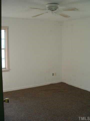 4005 Wheaton Road Durham, NC 27704 - Photo 5 of 7 an empty room with a empty space