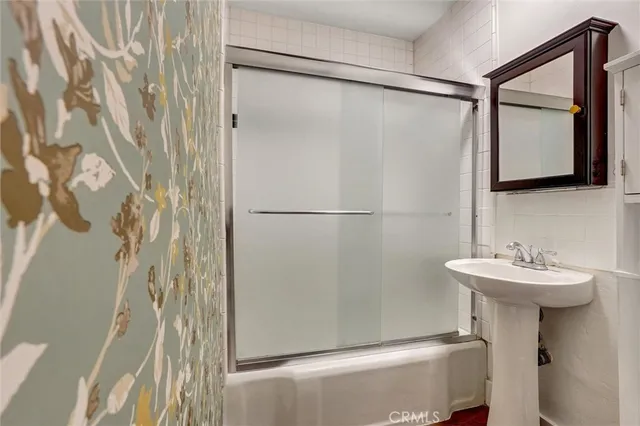 a bathroom with a sink and mirror