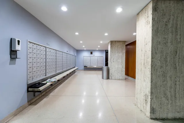 a view of a hall with stairs