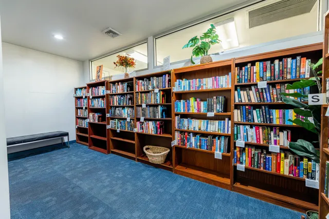 a utility room with stainless steel appliances washer and dryer