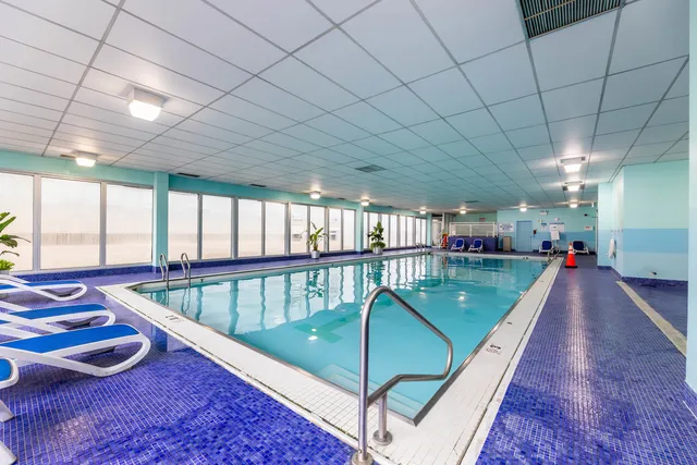 a picture of a bench in front of a window