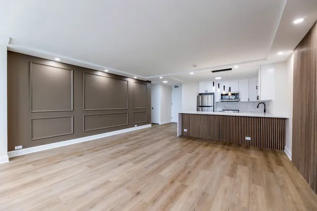 a view of a kitchen with a sink and cabinets