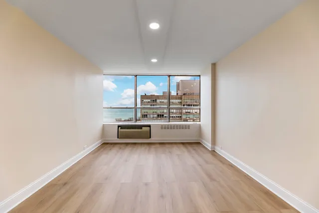 a view of a kitchen and microwave