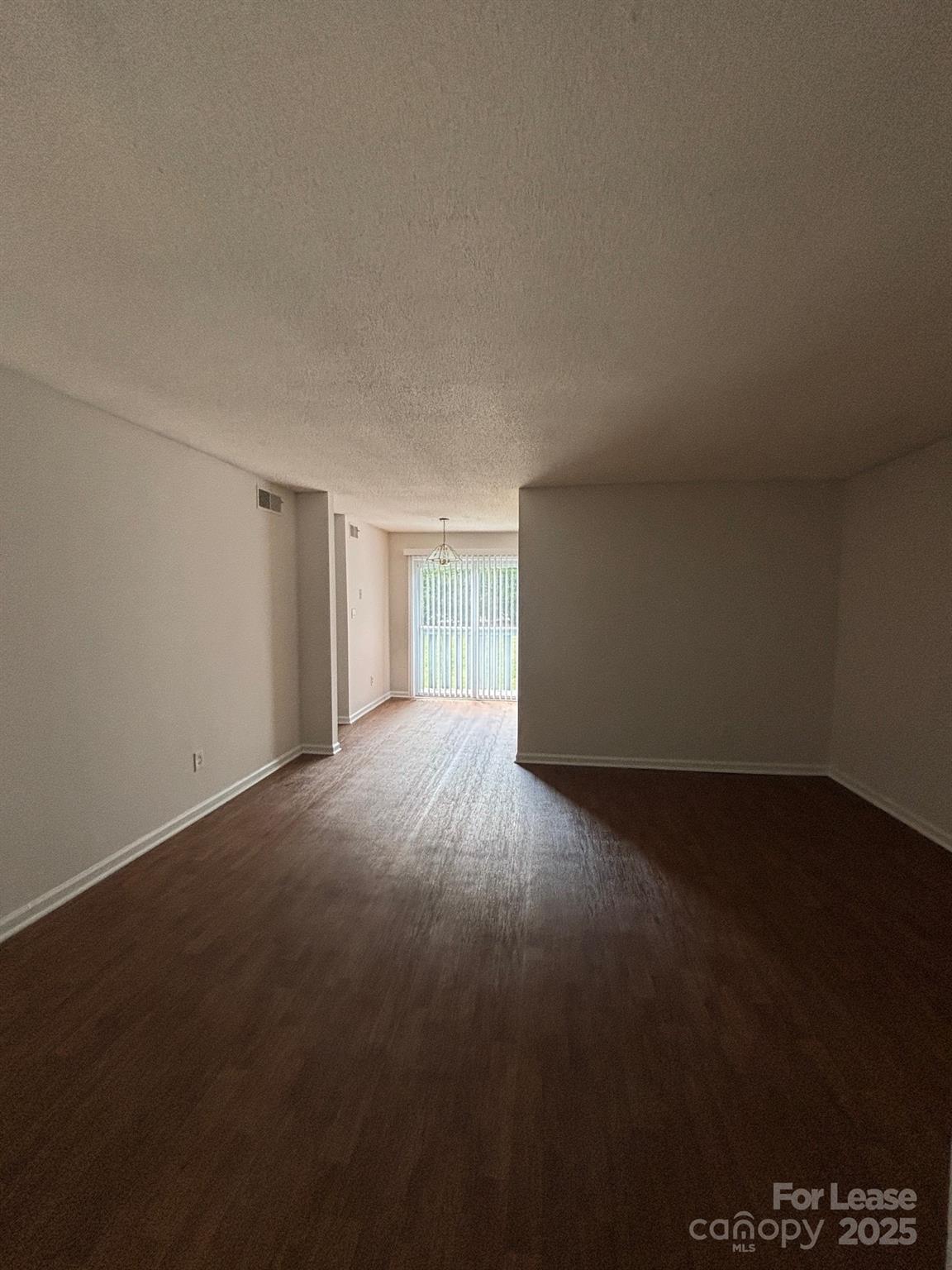 2026 Harvest Lane, Unit 85 Charlotte, NC 28210 - Photo 1 of 4 a view of an empty room with a window