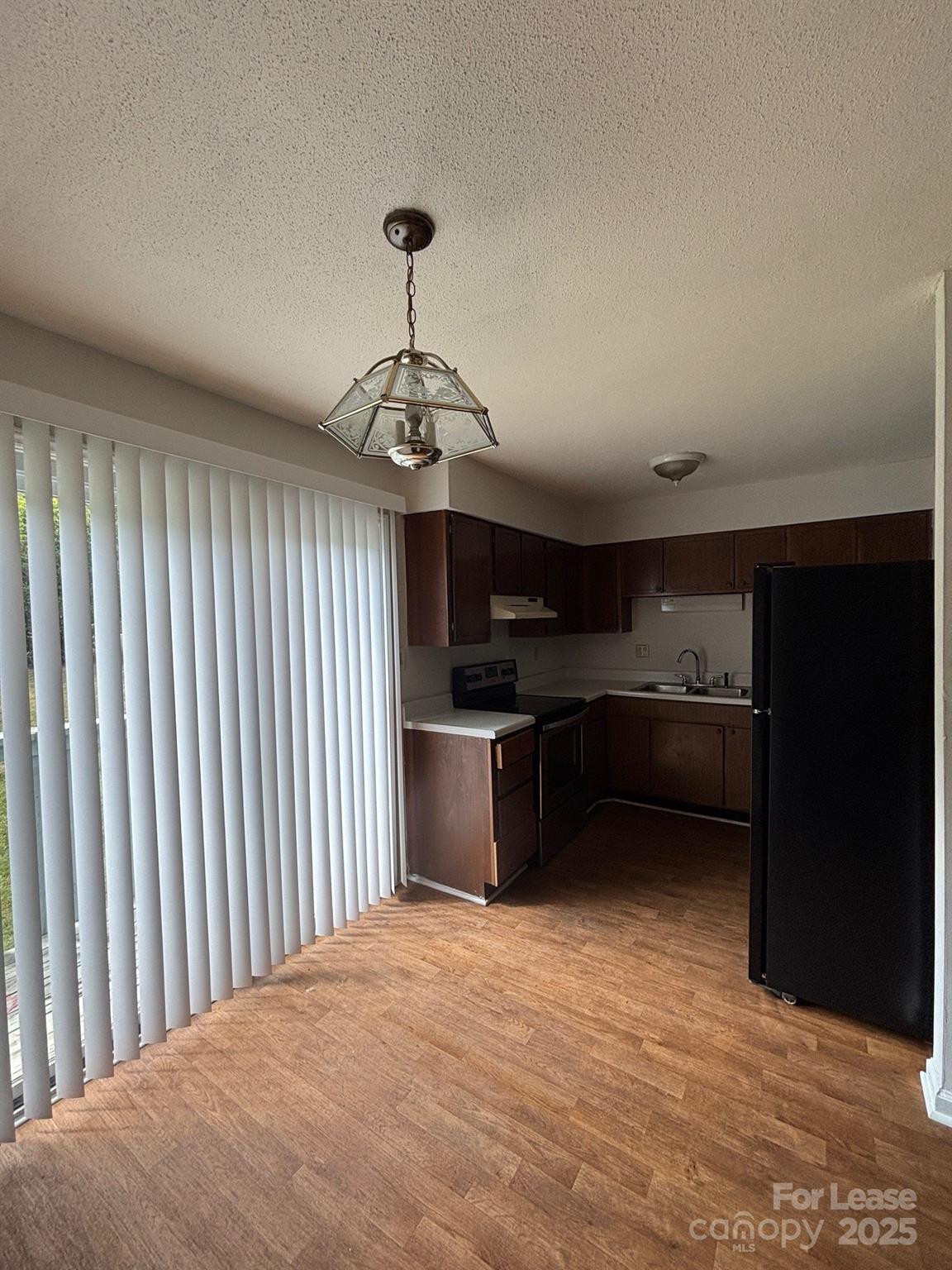 2026 Harvest Lane, Unit 85 Charlotte, NC 28210 - Photo 2 of 4 a view of kitchen and microwave