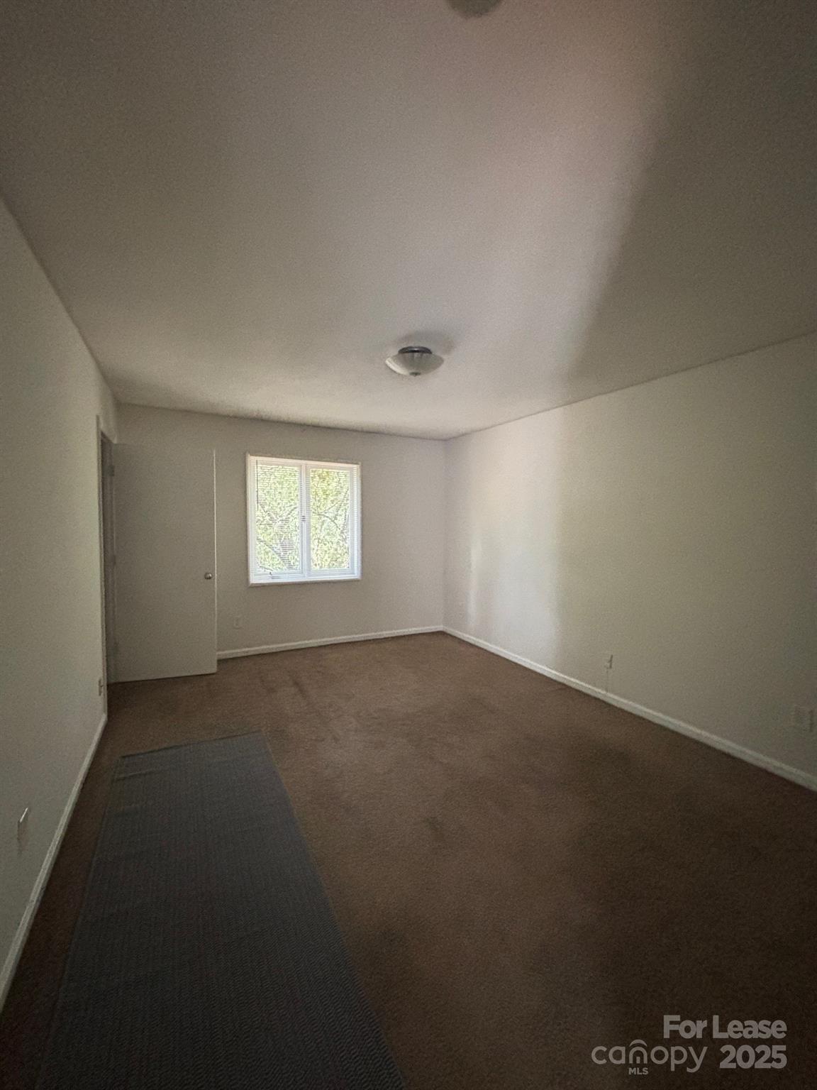 2026 Harvest Lane, Unit 85 Charlotte, NC 28210 - Photo 3 of 4 a view of an empty room and a window