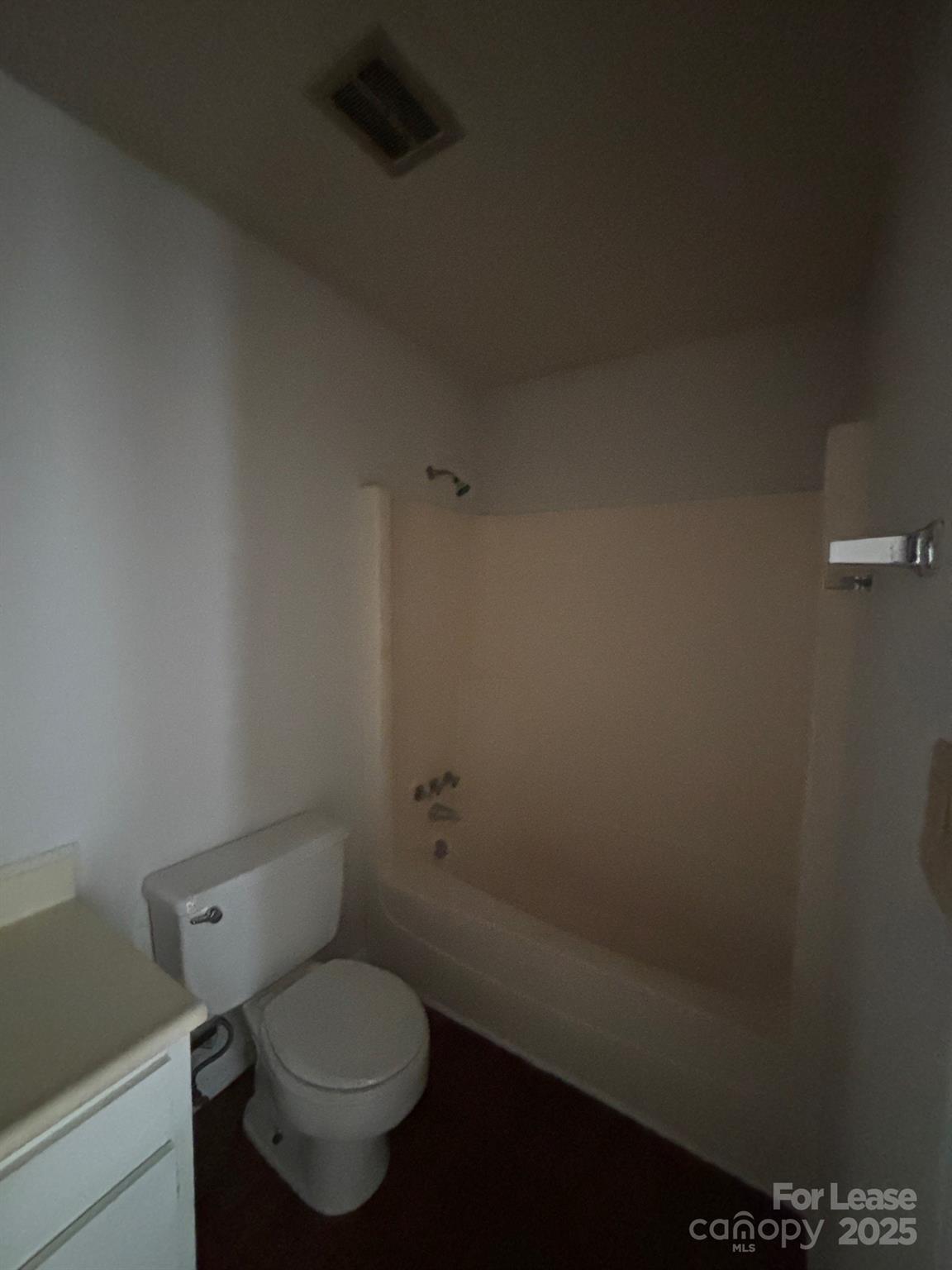 2026 Harvest Lane, Unit 85 Charlotte, NC 28210 - Photo 4 of 4 a white toilet sitting next to a small window