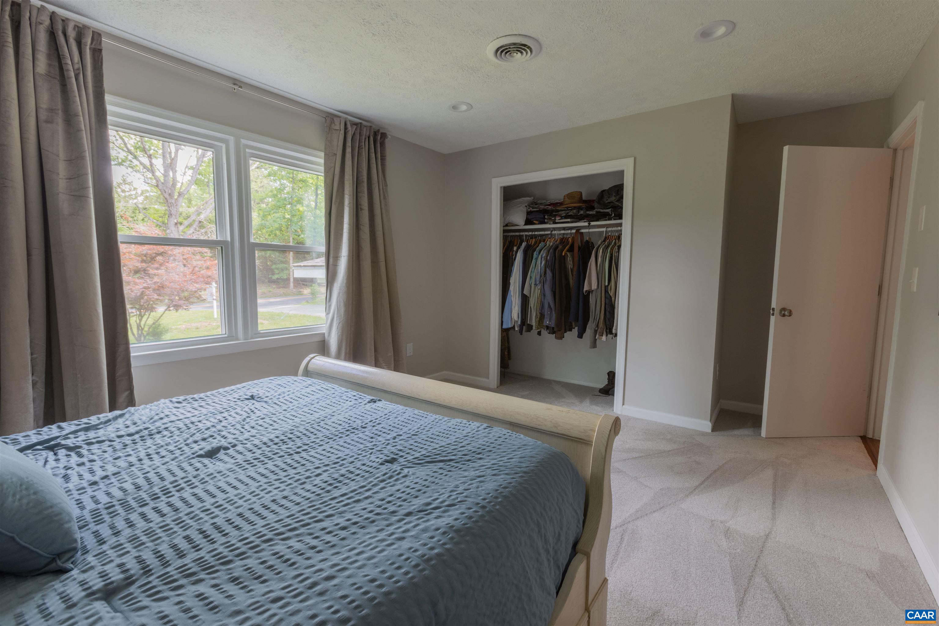 2550 Proffit Road Charlottesville, VA 22911 - Photo 16 of 41 a bedroom with a bed and a window