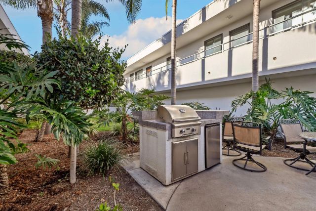a view of a chairs and table in a parking area