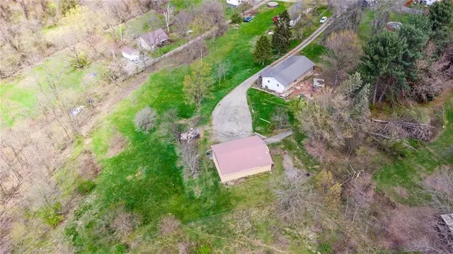 a aerial view of a house with a yard
