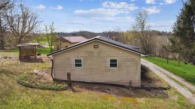 a view of a house with backyard