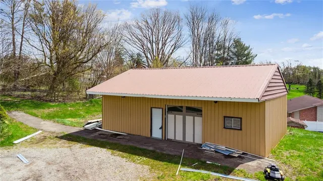 a side view of a house with a yard