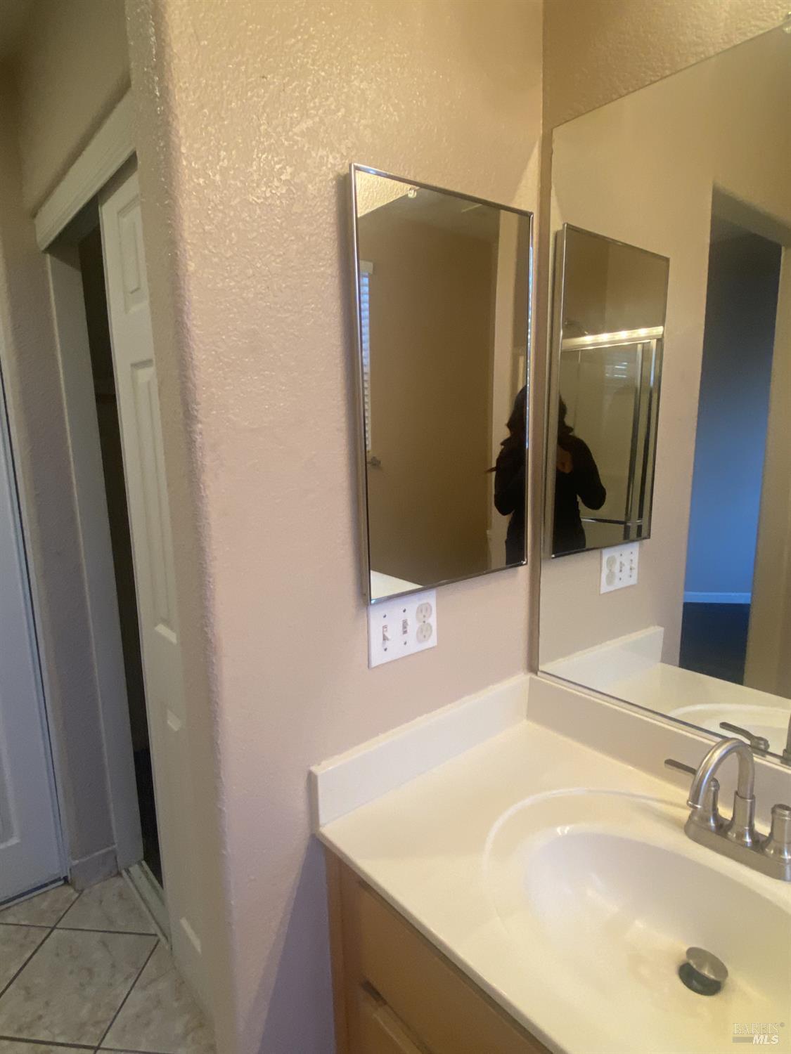 706 Anderson Way Rio Vista, CA 94571 - Photo 8 of 13 a bathroom with a sink and a mirror