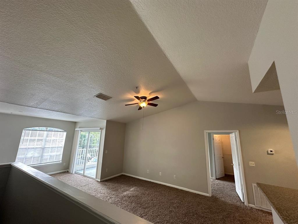 4348 South Kirkman Road, Unit 812 Orlando, FL 32811 - Photo 18 of 22 a view of an empty room with a window