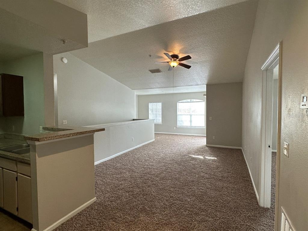 4348 South Kirkman Road, Unit 812 Orlando, FL 32811 - Photo 2 of 22 a view of a kitchen cabinets and a stove