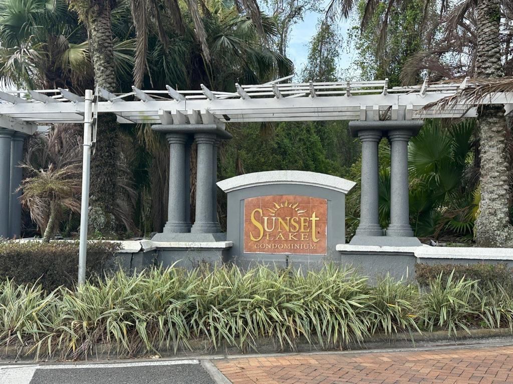 4348 South Kirkman Road, Unit 812 Orlando, FL 32811 - Photo 21 of 22 a view of outdoor space with sign board