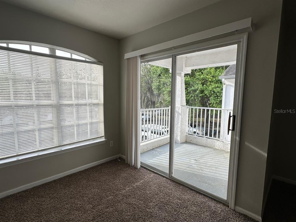 4348 South Kirkman Road, Unit 812 Orlando, FL 32811 - Photo 7 of 22 a view of a room that has a bed and a window