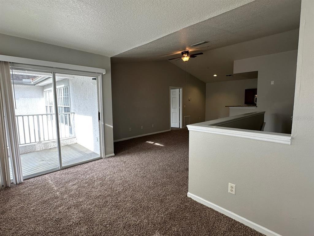 4348 South Kirkman Road, Unit 812 Orlando, FL 32811 - Photo 8 of 22 a view of a livingroom with a sink