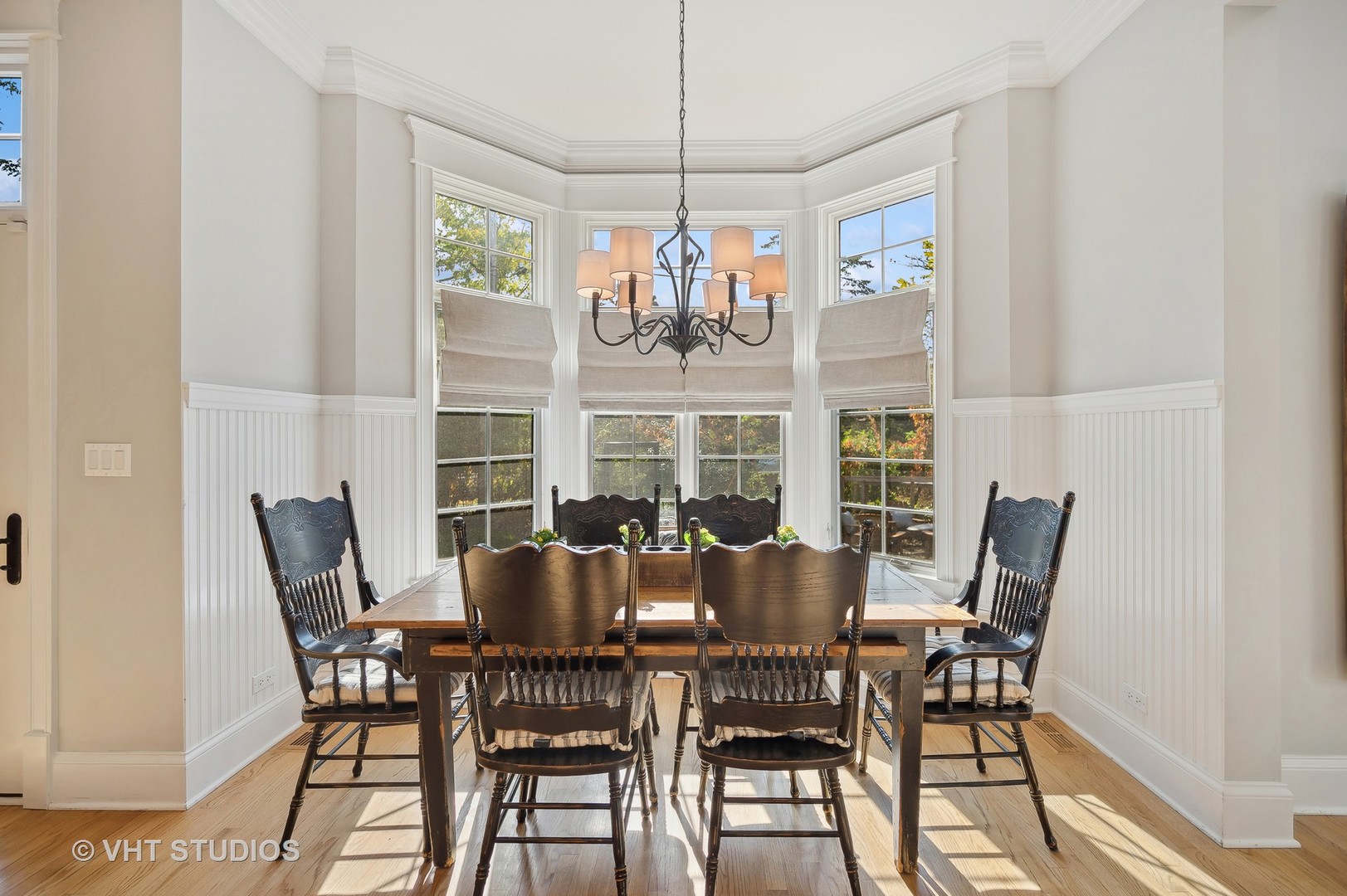 907 Queens Lane Glenview, IL 60025 - Photo 13 of 39 a view of a dining room with furniture wooden floor and chandelier