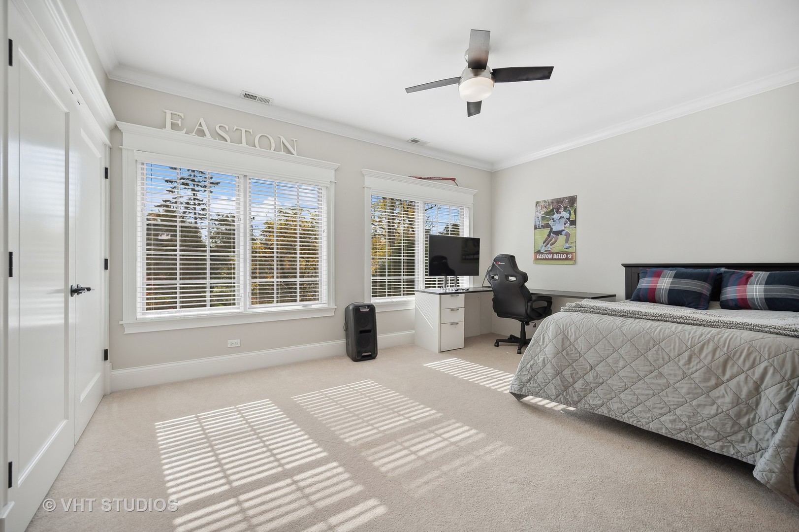 907 Queens Lane Glenview, IL 60025 - Photo 26 of 39 a spacious bedroom with a bed a chandelier and large window