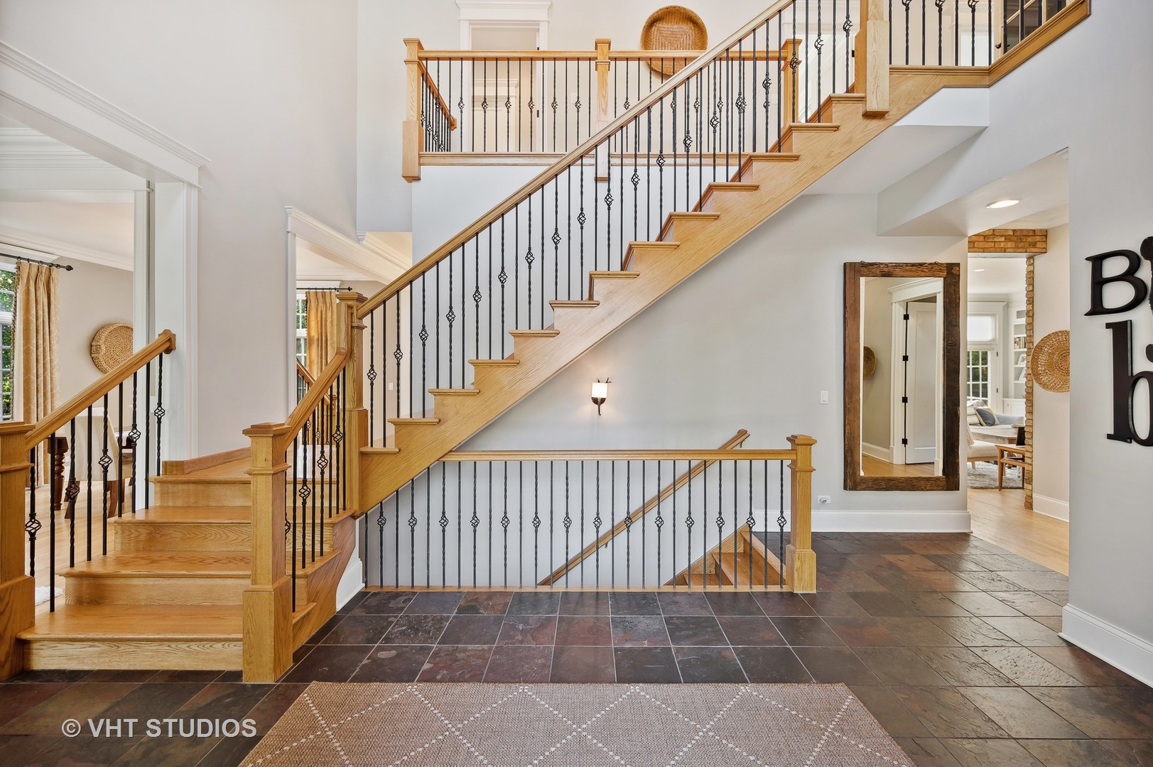 907 Queens Lane Glenview, IL 60025 - Photo 5 of 39 a view of staircase with wooden floor and a rug