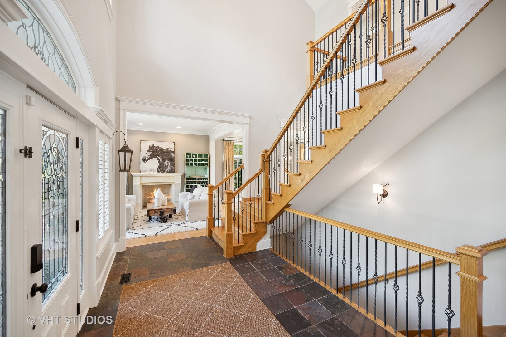 907 Queens Lane Glenview, IL 60025 - Photo 6 of 39 a view of entryway with wooden floor and a front door
