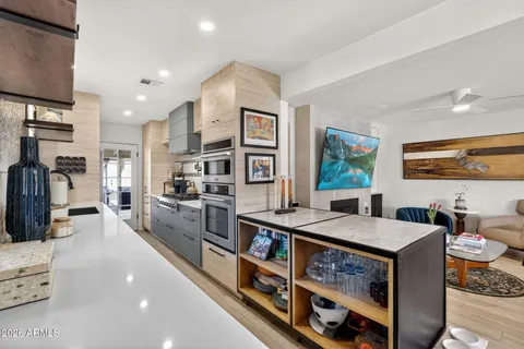 a kitchen with stainless steel appliances granite countertop lots of counter top space