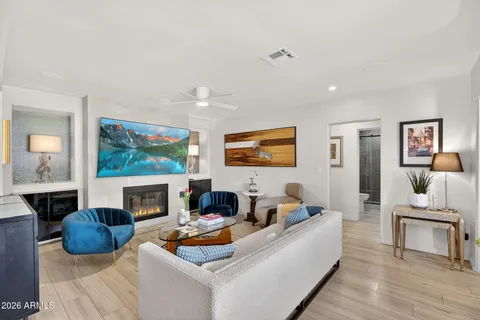 a living room with furniture and a large window