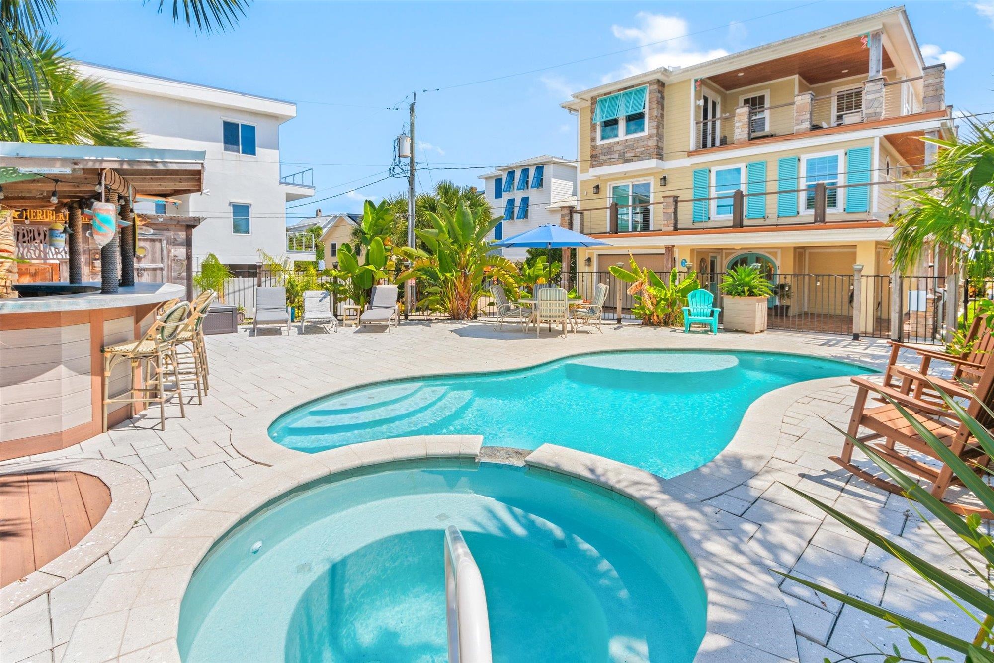 1 2nd Lane St. Augustine, FL 32080 - Photo 2 of 86 View of swimming pool featuring a patio, a balcony, and a pool with connected hot tub