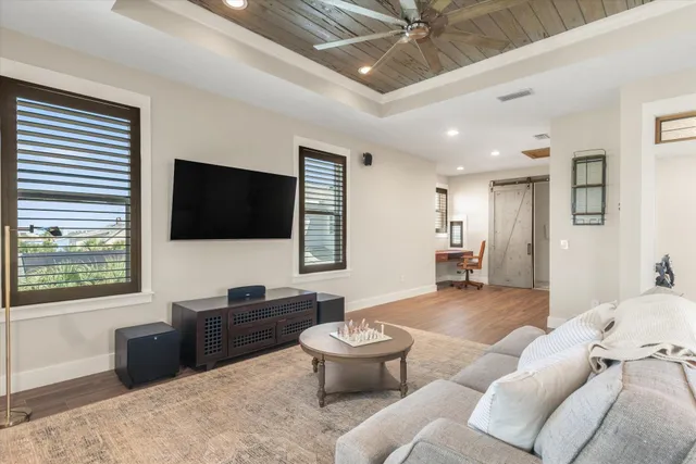 a bedroom with a bed and a tv