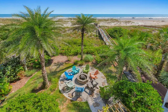 a bathroom with a granite countertop sink mirror and a bathtub