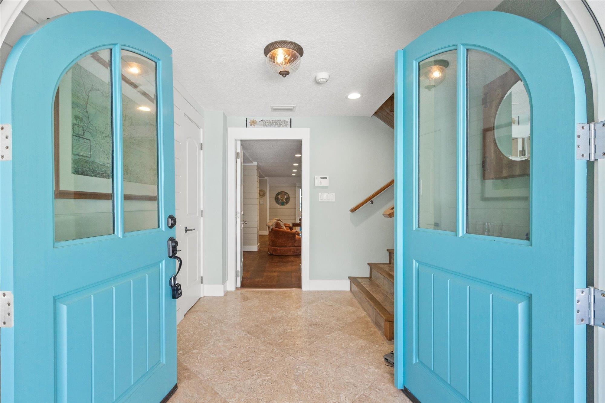 1 2nd Lane St. Augustine, FL 32080 - Photo 26 of 86 Foyer entrance featuring a textured ceiling and stairs
