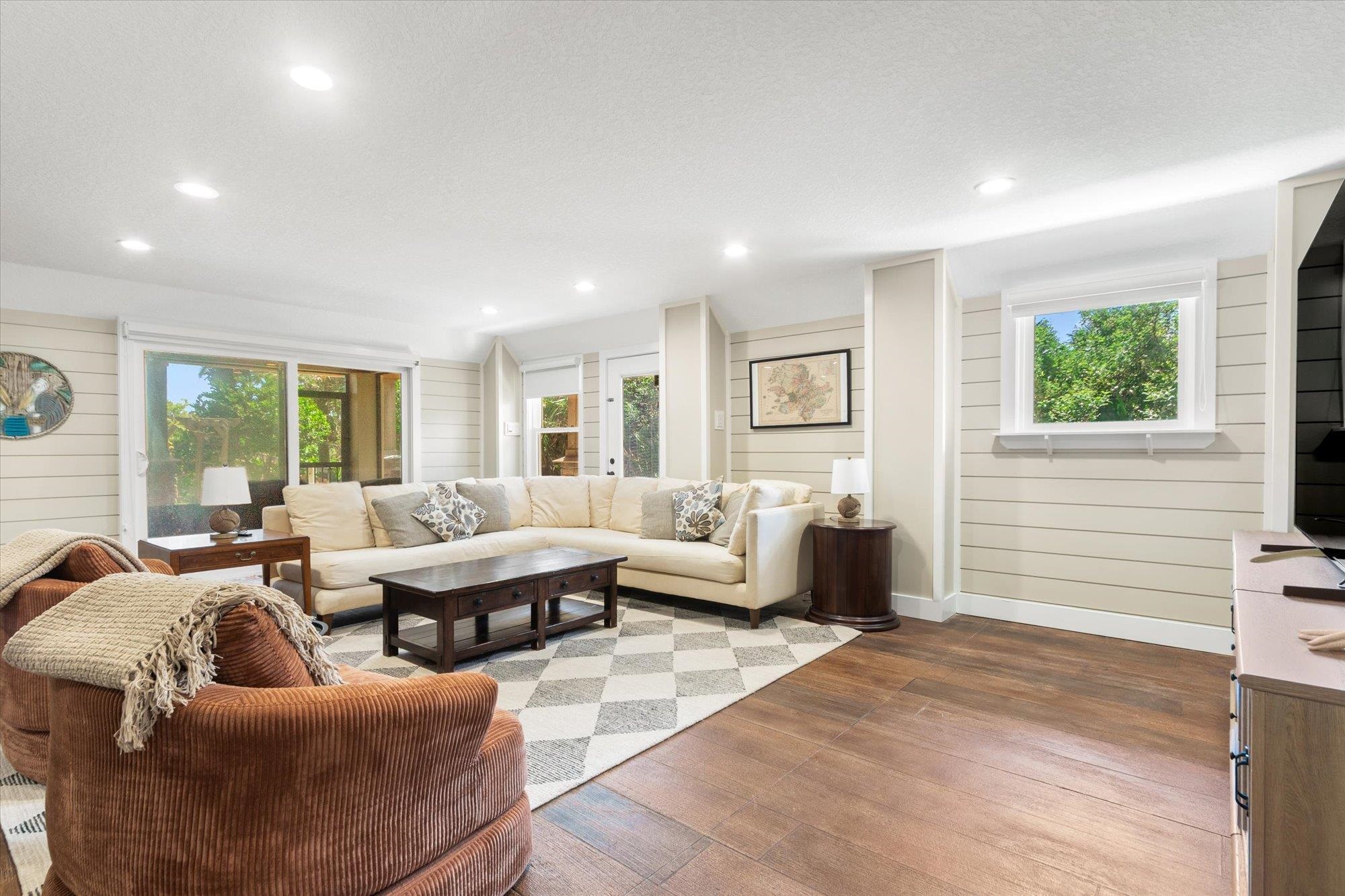 1 2nd Lane St. Augustine, FL 32080 - Photo 29 of 86 Living area with hardwood / wood-style flooring, healthy amount of natural light, wood walls, and recessed lighting