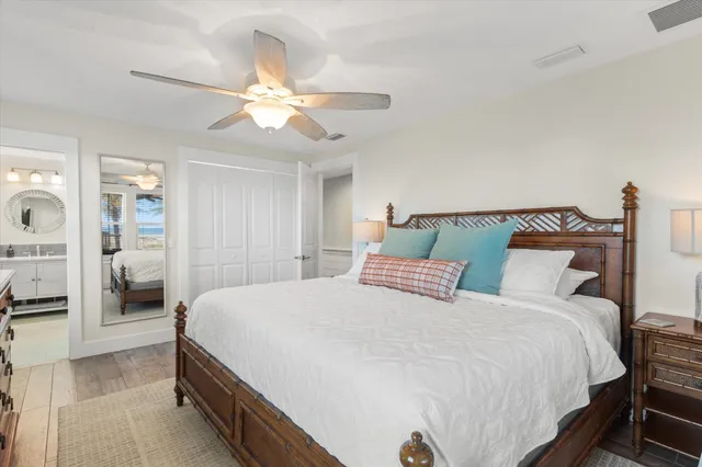 a view of a patio with table and chairs potted plants and palm tree