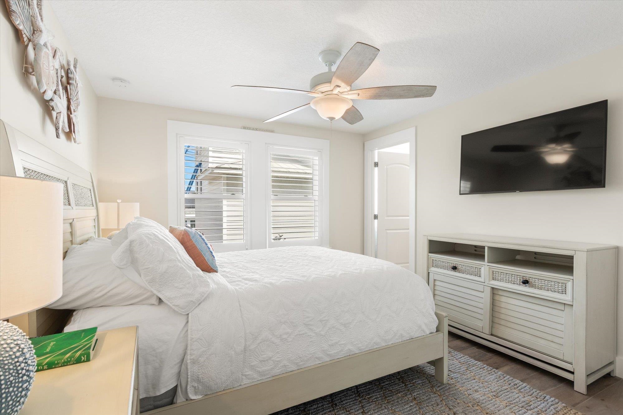 1 2nd Lane St. Augustine, FL 32080 - Photo 48 of 86 a bedroom with a bed and a flat screen tv