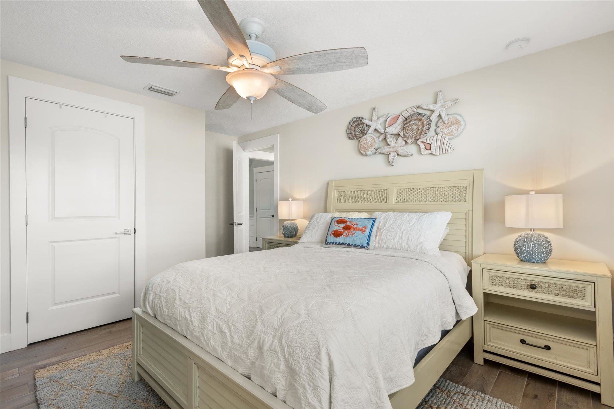 1 2nd Lane St. Augustine, FL 32080 - Photo 49 of 86 a bedroom with a bed and a chandelier