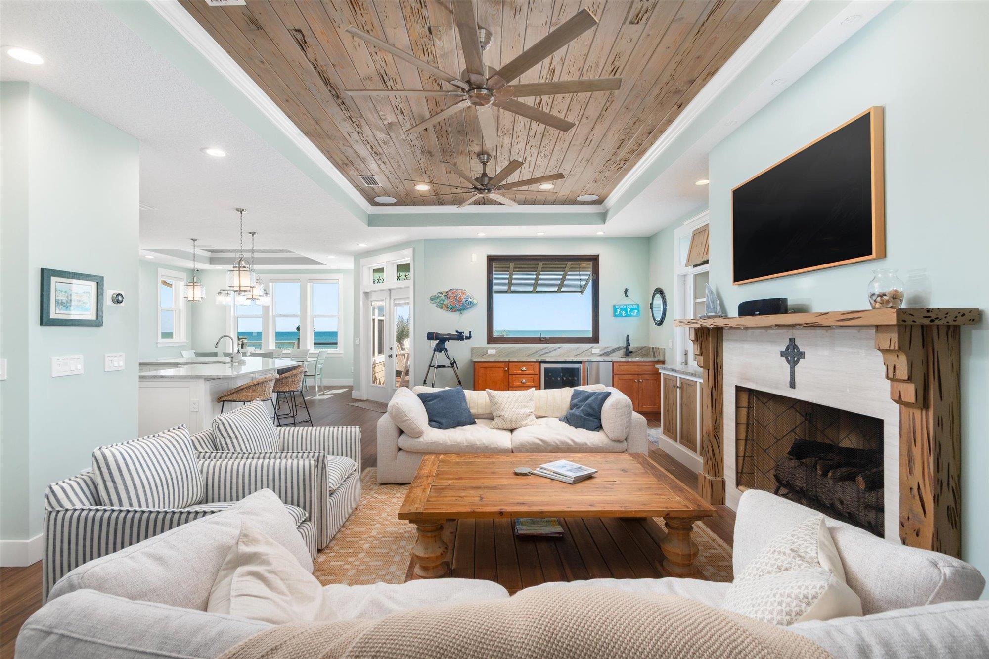 1 2nd Lane St. Augustine, FL 32080 - Photo 6 of 86 a living room with furniture a flat screen tv and a fireplace