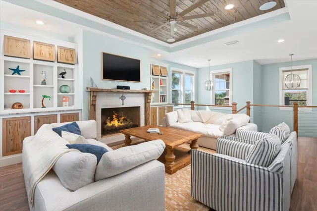 a open kitchen with white cabinets and white appliances
