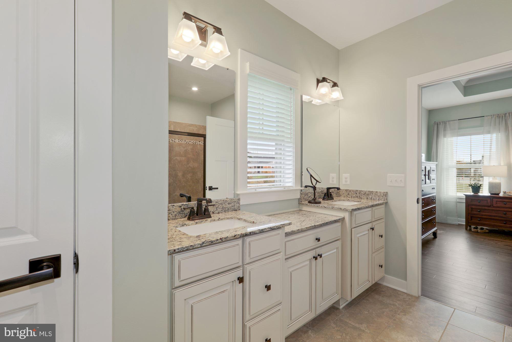 23576 Robalo Road Frankford, DE 19945 - Photo 27 of 47 Lavish En-Suite Bath with Double Sink Vanity