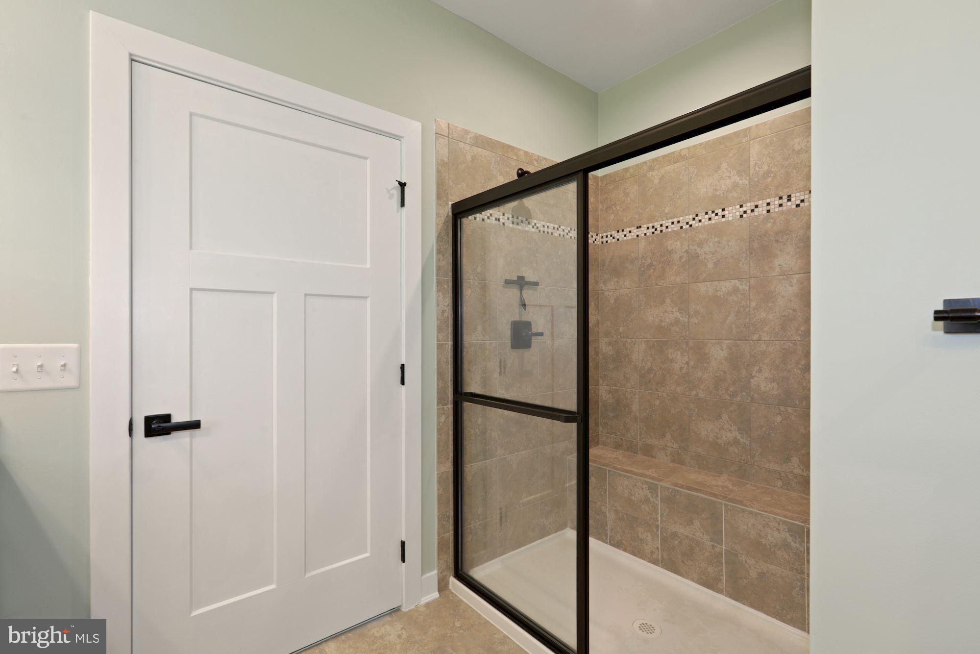 23576 Robalo Road Frankford, DE 19945 - Photo 28 of 47 Tiled Shower with Double Shower Heads