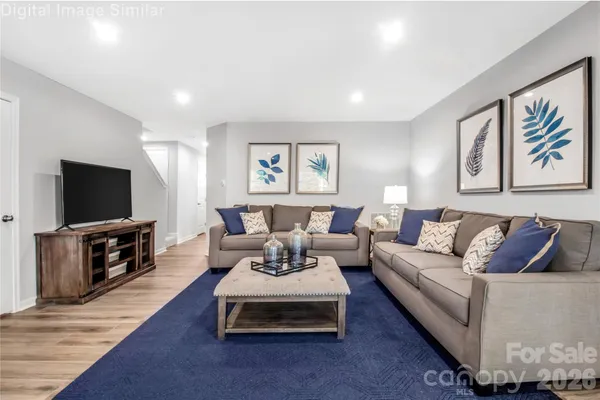 a living room with furniture and a flat screen tv