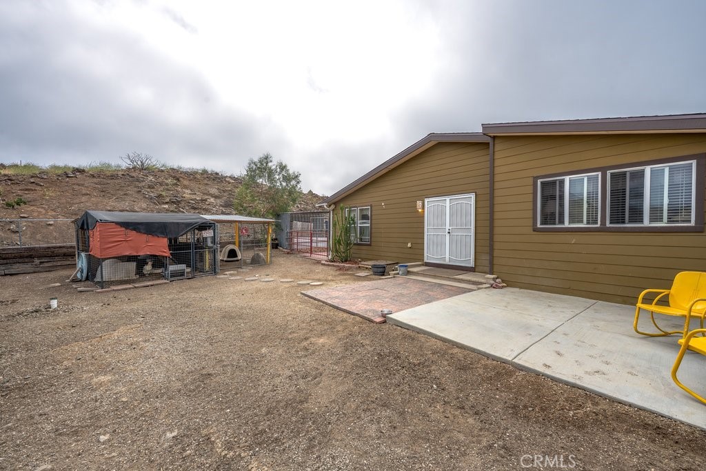 33330 Palen Road Agua Dulce, CA 91390 - Photo 56 of 56 a view of a house with backyard and sitting area