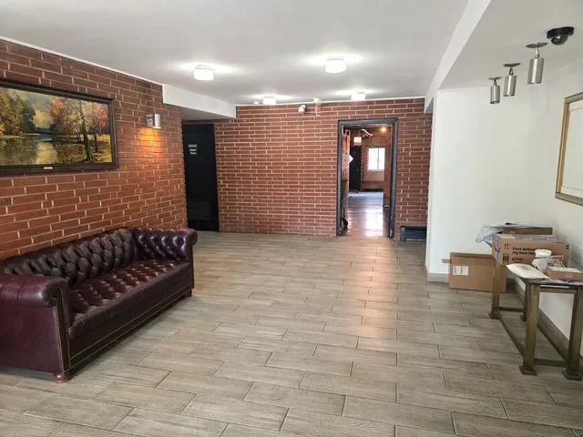 a spacious bathroom with a sink and a mirror
