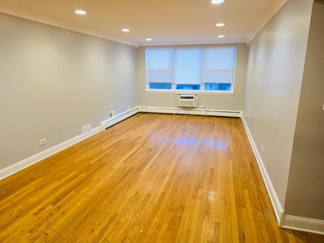a view of wooden floor and brick walls