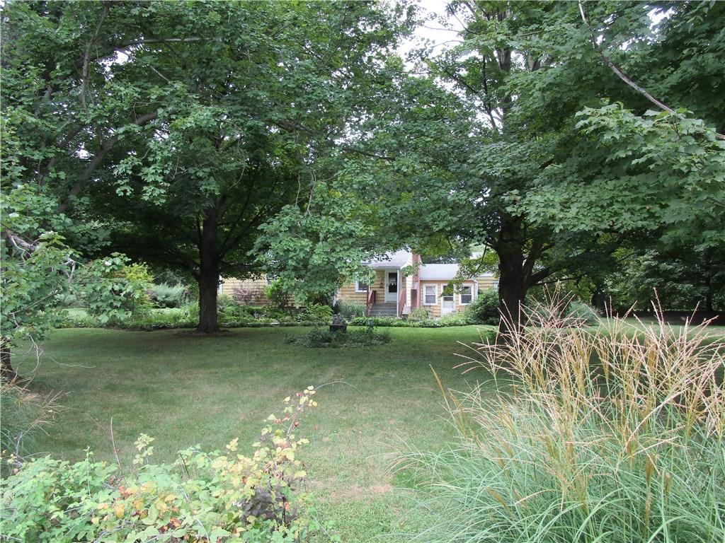 53 Mountain View Road Fishkill, NY 12524 - Photo 1 of 1 a backyard of a house with table and chairs