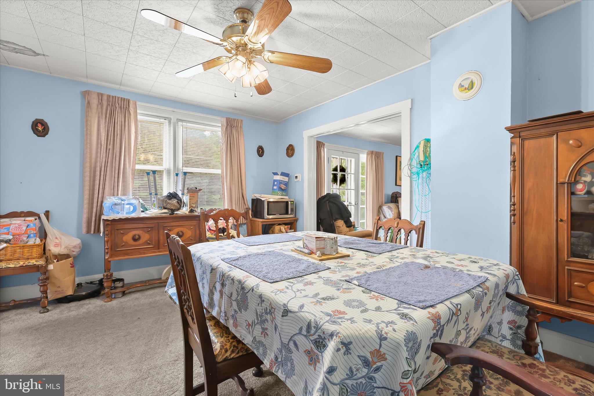 3703 Clayton Road Joppa, MD 21085 - Photo 15 of 31 a dining room with a table chairs and a refrigerator