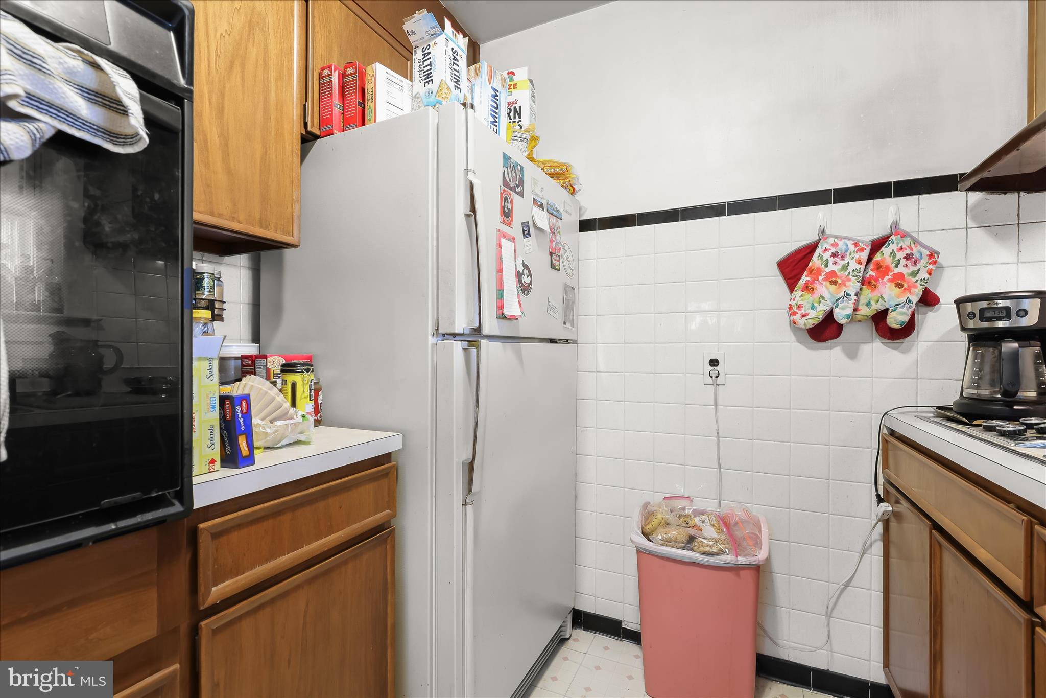 3703 Clayton Road Joppa, MD 21085 - Photo 18 of 31 a utility room with lots of clutter and cabinets