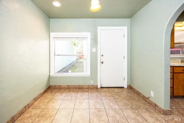 a bathroom with a sink vanity mirror and tub
