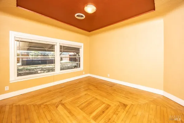 a view of an empty room with a window