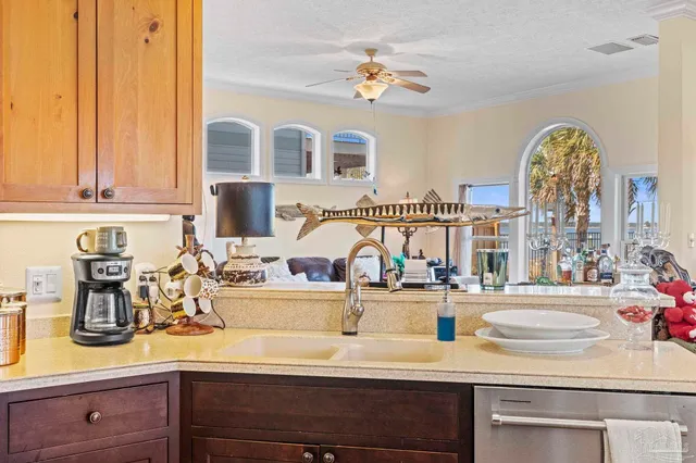 a kitchen with a faucet a dining table and chairs